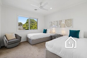A hotel room with two beds, a chair, a ceiling fan, and artwork on the wall. - The Sorrento Sojourn *1 NIGHT FREE* Luxury Spa Retreat (Sorrento)