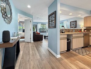 A modern kitchen with wooden cabinets, a countertop, and a built-in oven. - No Stairs, Lakeside, beautiful patio and yard (Branson)