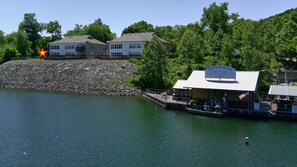 A marina with a dock, a building with a sign, and a star symbol. - No Stairs, Lakeside, beautiful patio and yard (Branson)
