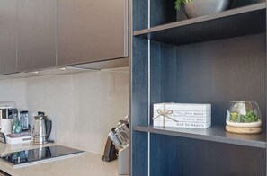A modern kitchen with a coffee machine, a kettle, and a knife block. - 15th Floor E11EVEN Retreat Near Miami Worldcenter (Miami)