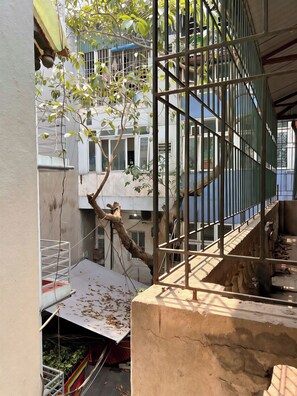 A tree with a metal railing in an outdoor area. - 3BR House, 4 Baths in Hanoi Old Quarter - Washer/Dryer & Kitchen - Zephyr (Hà Nội)