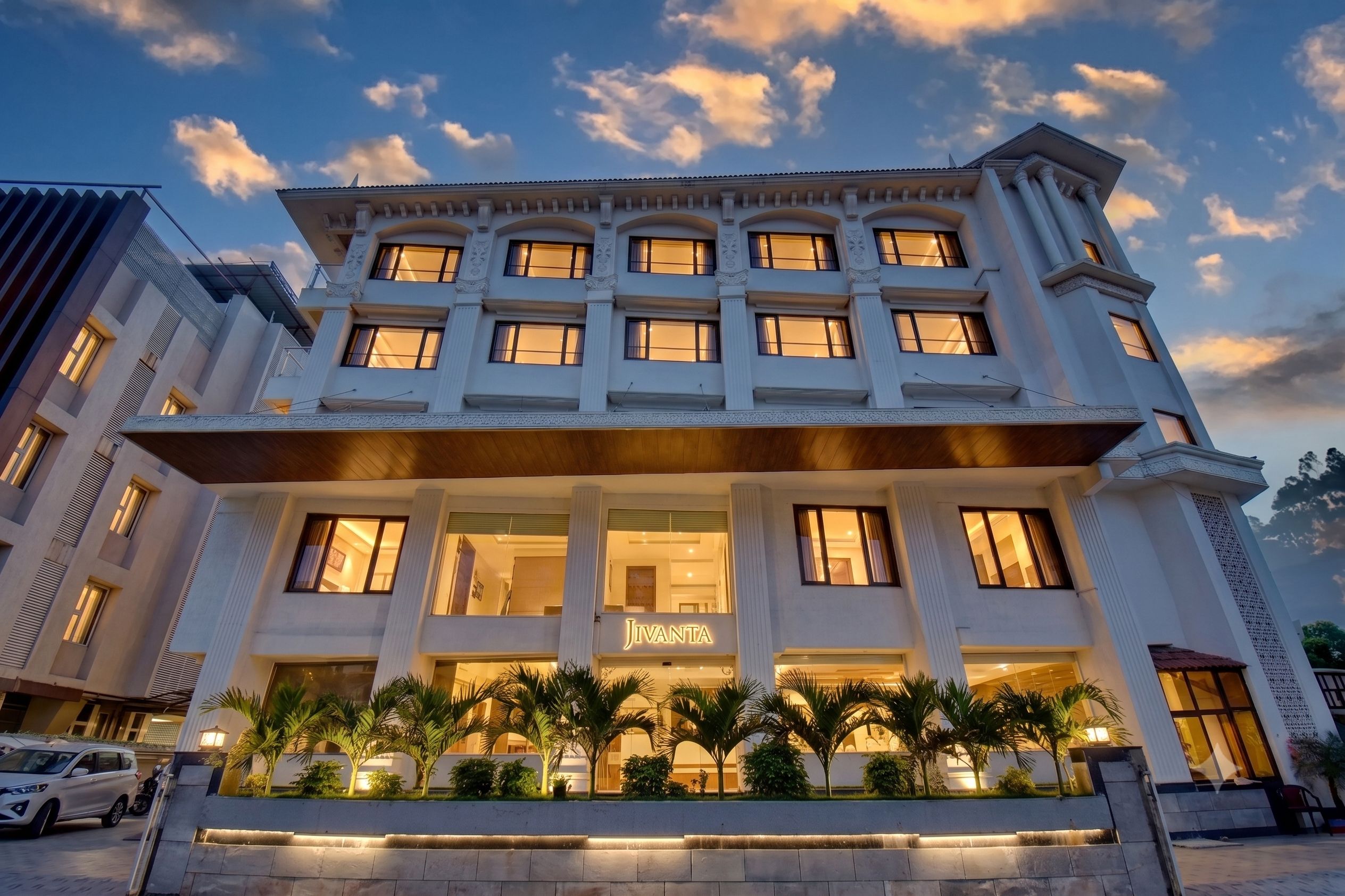 A multi-story hotel with a prominent entrance, large windows, and a sign reading 'JIVANIA'.
