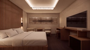 A modern hotel room with a bed, seating area, flat-screen TV, and artwork on the wall. - Restia Gimhae Jangyu (Gimhae)
