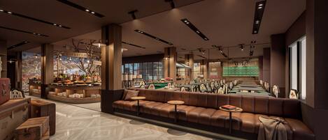 A modern interior with a seating area, a buffet, and a view of the kitchen.