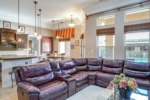 A spacious living area with a large leather sectional sofa, a kitchen with a stone backsplash, and a dining area with a table and chairs. - Bakersfield Guest Suite, 11 Mi to Dtwn! (Bakersfield)