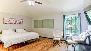 A bedroom with a bed, a chair, a desk, a ceiling fan, and a window with curtains. - Games & Yard! Family Home Near Kemah Boardwalk (Dickinson)