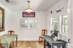 A kitchen with a dining table, chairs, a coffee machine, and a window with blinds. - Great for Families! Dothan Getaway w/ Large Yard (Dothan)