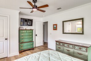A bedroom with a bed, a dresser, a television, and a ceiling fan. - Great for Families! Dothan Getaway w/ Large Yard (Dothan)