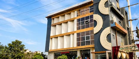 A modern building with a prominent sign reading 'SHUBH SHALEEN SPRINGS'.