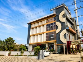 A modern building with a prominent sign reading 'SHUBH SHALEEN SPRINGS'.