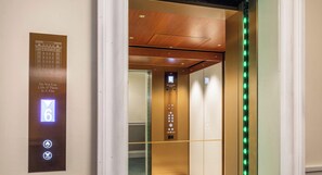 An elevator interior with a digital display indicating floor 6, emergency instructions, and a control panel with various buttons. - 3BR Art Deco Retreat in the Heart of Potts Point (Potts Point)