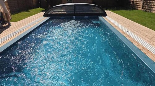 Lodge with a private heated pool