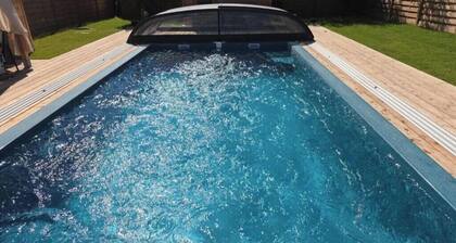 Lodge with a private heated pool