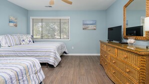 A bedroom with a bed, a television, a dresser, and a ceiling fan. - New Listing! Gorgeous Golf Views 2 BR Condo Palmetto Dunes Resort (Hilton Head Island)
