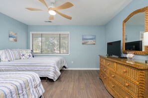A bedroom with a bed, a television, a dresser, and a ceiling fan. - New Listing! Gorgeous Golf Views 2 BR Condo Palmetto Dunes Resort (Hilton Head Island)