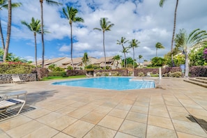 A swimming pool with lounge chairs and palm trees. - Maui Kamaole #K-104 Quiet Location, Close to Resort Pool, A/C (Kihei)