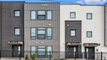 A multi-story residential building with numbered units 2176-5, 2176-4, and 2176-3.