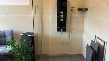 Shower, hair dryer, towels, soap