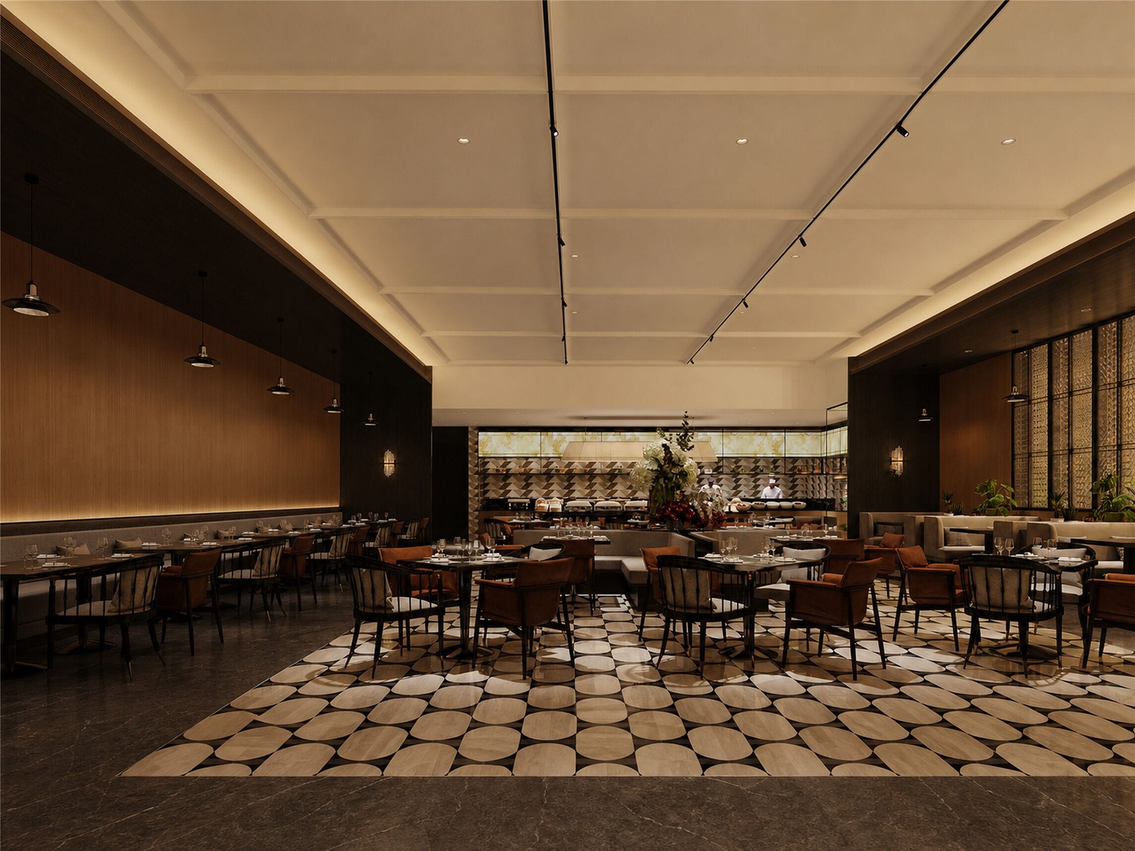 Un restaurant ampli amb sostres alts, il·luminació moderna i un paviment amb dibuixos.