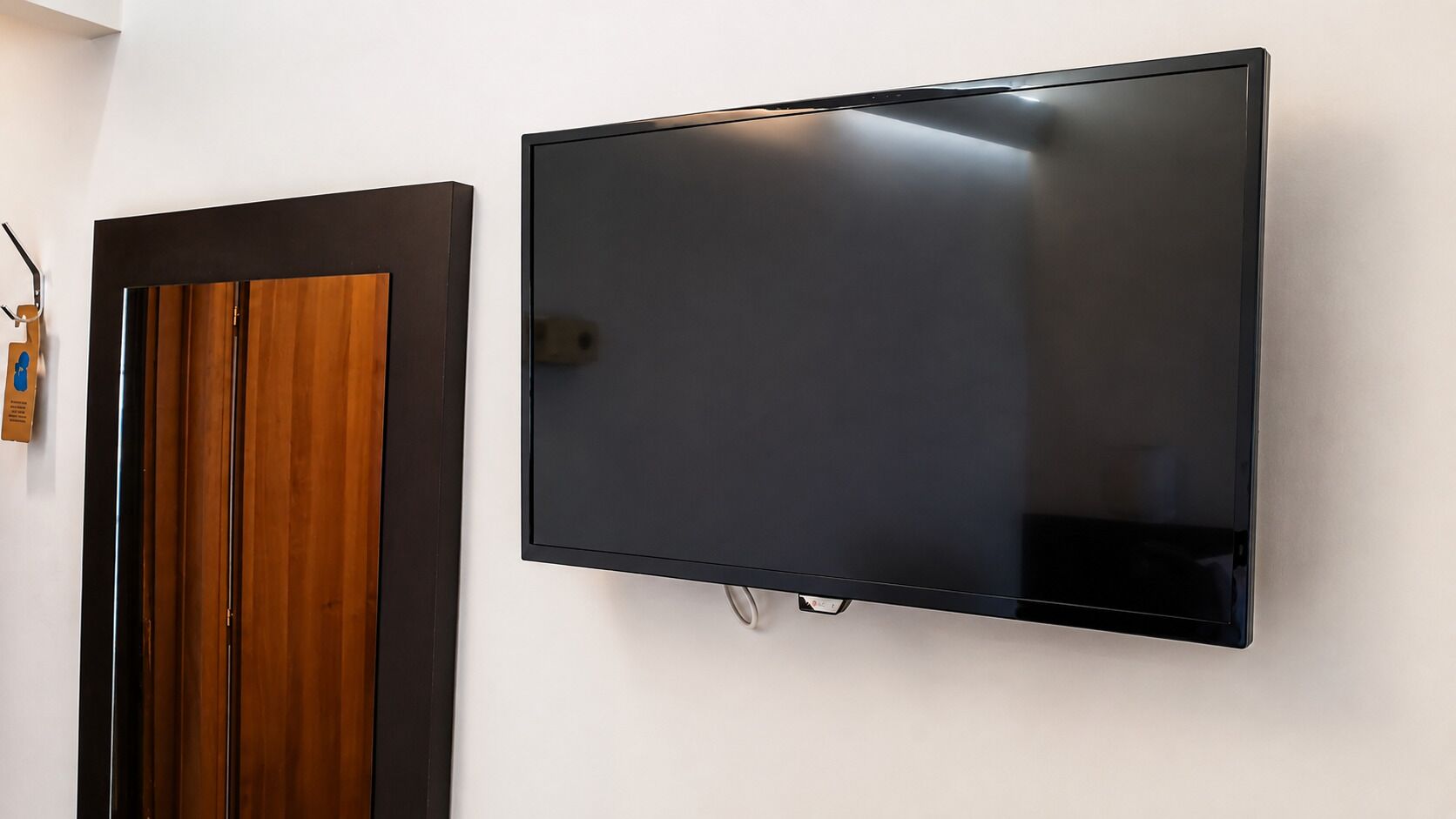 A flat-screen TV mounted on a wall.