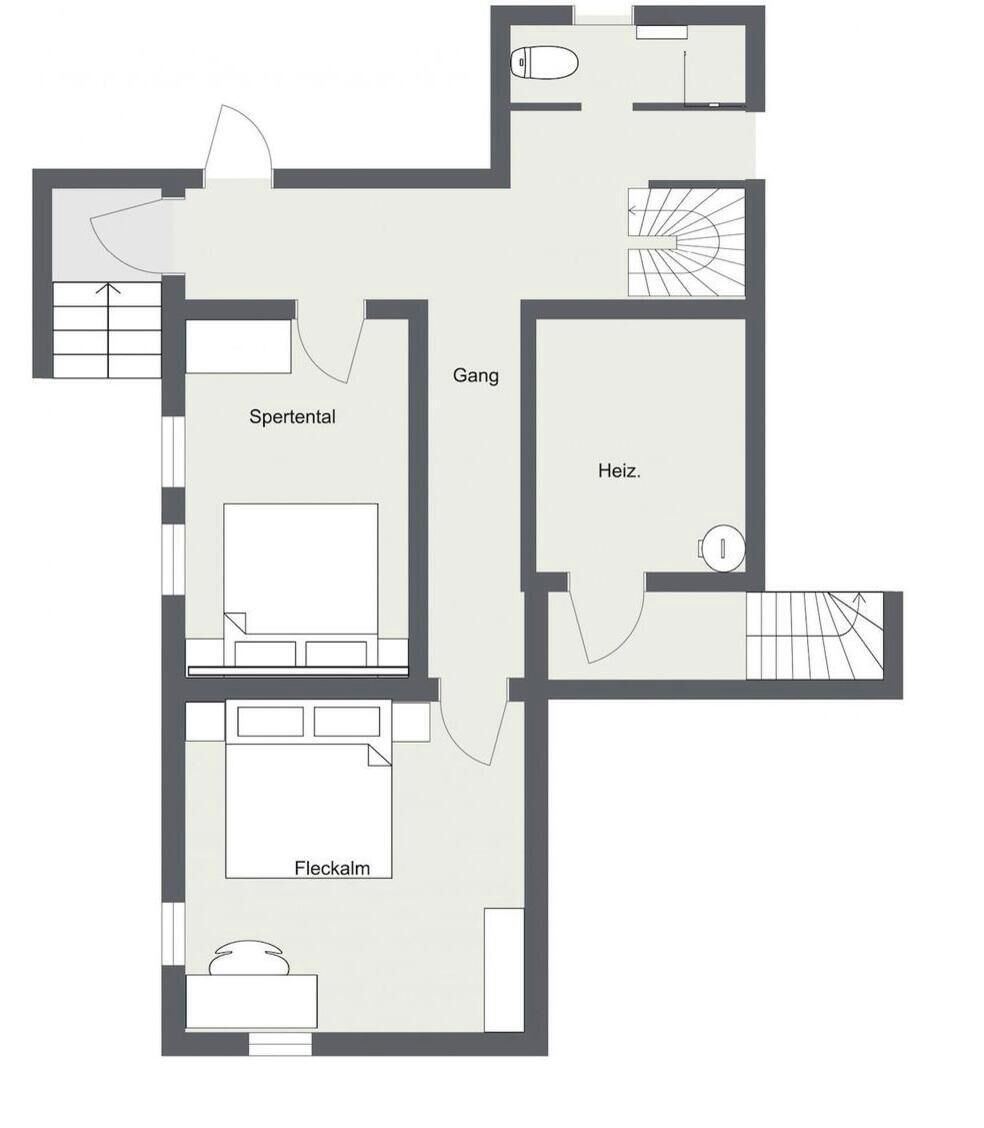 Ein Grundriss mit Schlafzimmer, Bad, Küche und Wohnbereich.