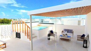 A rooftop terrace with a pool, outdoor seating, and a pergola. - Private Rooftop Plunge Pool Sun Deck Beaches BBQ (Punta Cana)