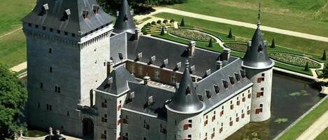 A large castle with multiple towers and a moat.