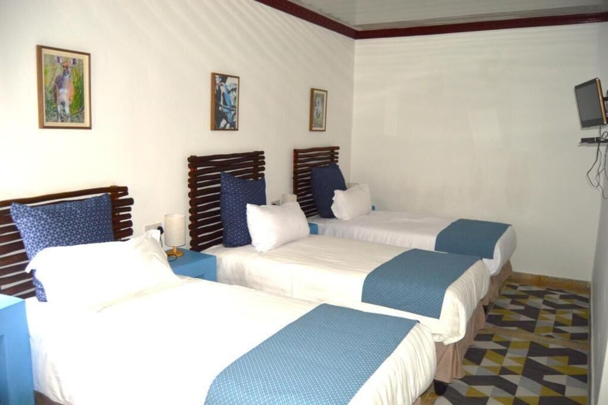 Kamar Triple Comfort, pemandangan kebun | Meja kerja, ruang kerja ramah laptop, dan Wi-Fi gratis