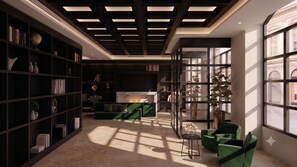 A modern library with a fireplace, green sofas, and a large window.