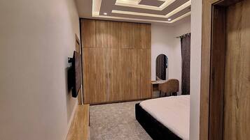 Deluxe Apartment, Balcony, City View | In-room safe, desk, laptop workspace, blackout curtains