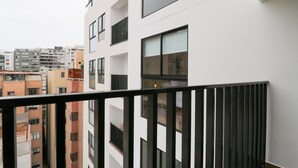 A modern apartment building with multiple balconies and large windows. - w* | Prime 2BR w/ Balcony in Miraflores (Miraflores)
