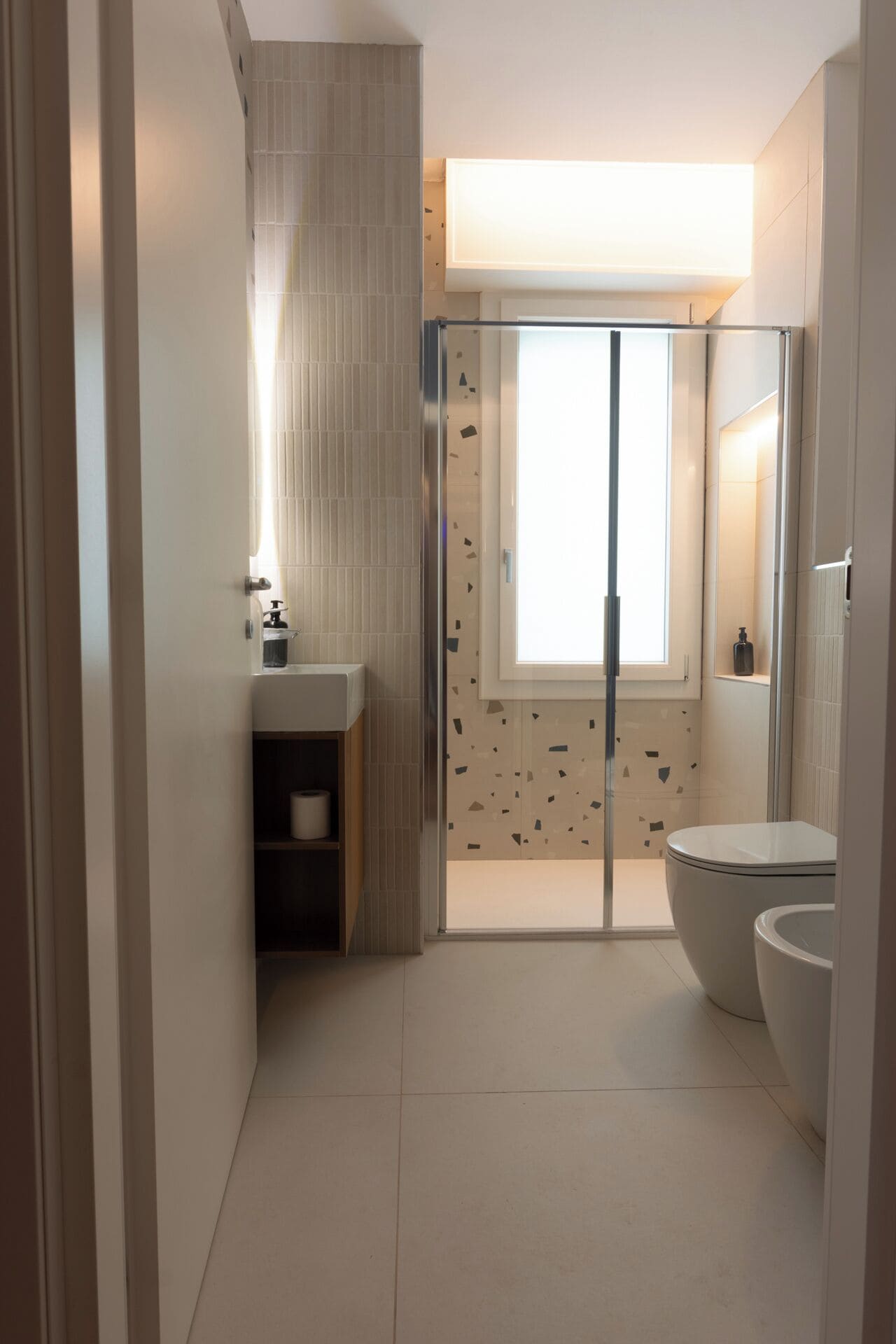 Shower, rainfall showerhead, bidet, towels