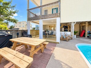 A two-story house with a covered patio, a pool, and a barbecue grill. - Private Pool · 3-Min Walk to Beach · Sleeps 8, Loaded, Pets OK (Nags Head)