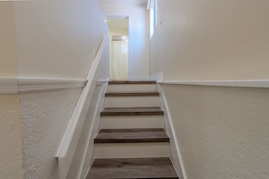 A staircase with a handrail leading to a doorway. - Gateway to the Keys - Private Family Retreat (Homestead)