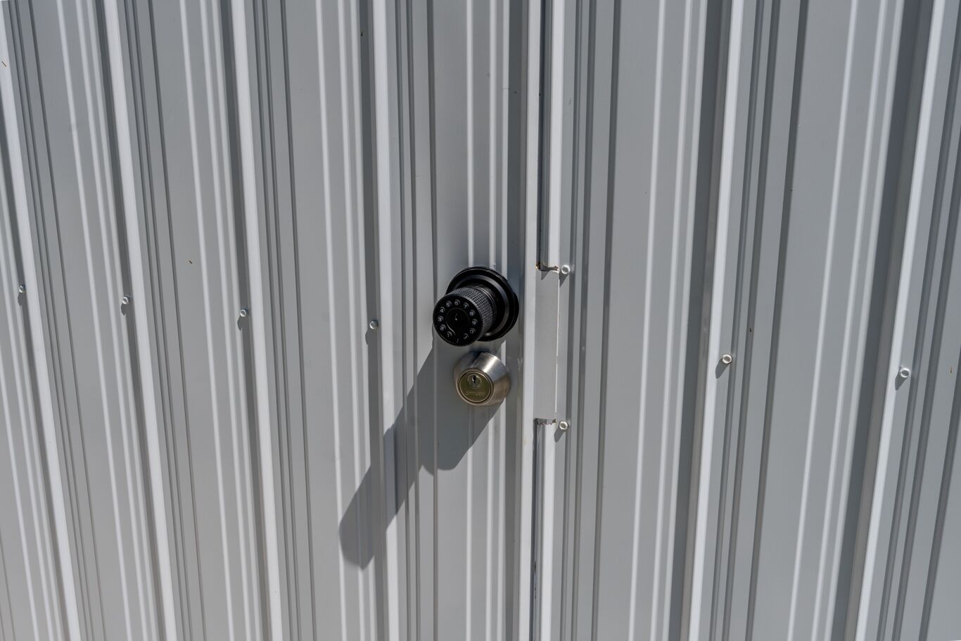 A metal door with a lock and a keyhole.