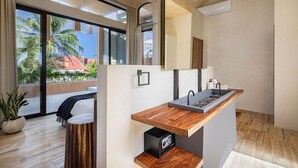 A modern bathroom with a wooden vanity, a large mirror, and a view of palm trees outside. - Villa Romeo | Jungle & Caribbean • Rooftop Pool (Tulum)