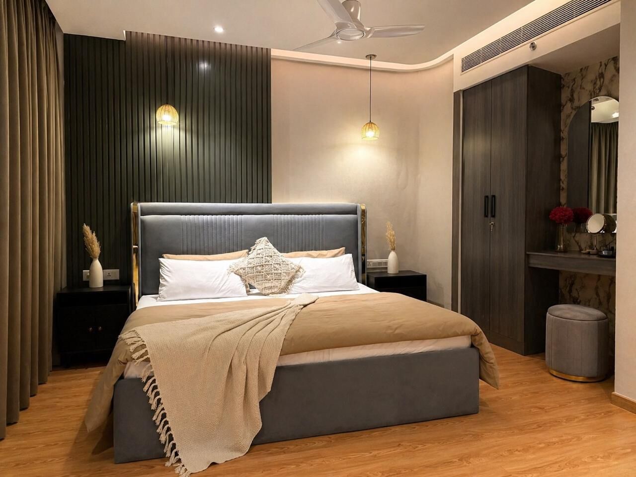 A modern bedroom with a large bed, a ceiling fan, and a wardrobe.