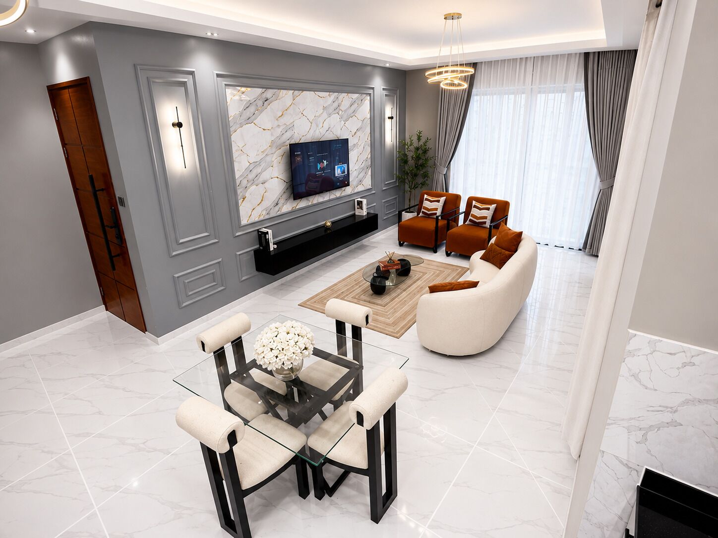 A modern living room with a marble wall, a flat-screen TV, a glass coffee table, and a sofa.