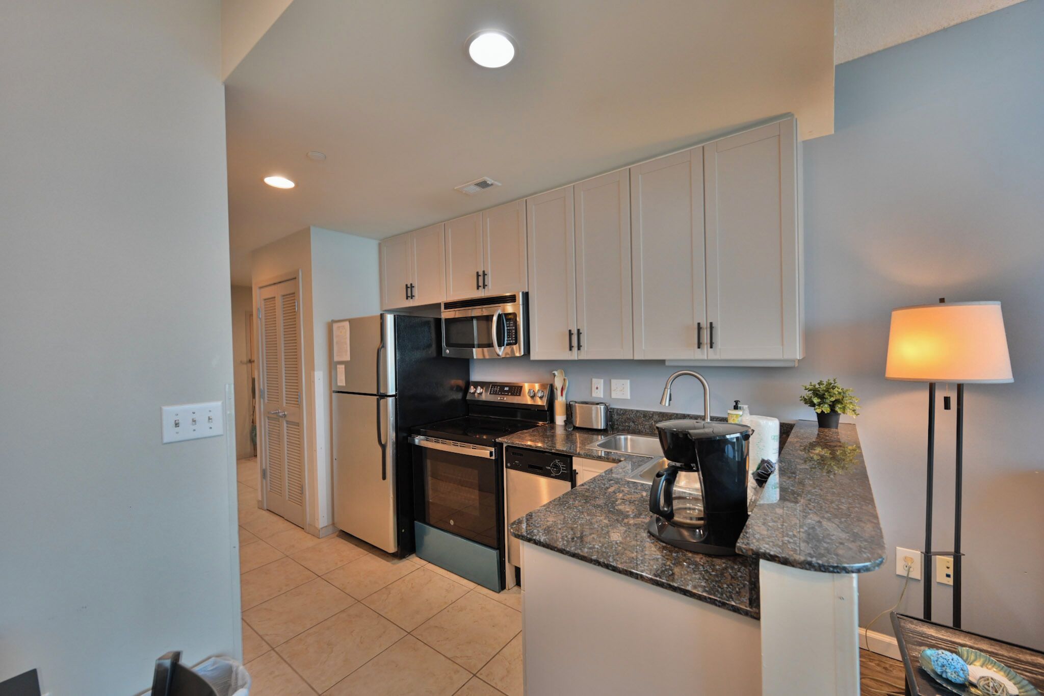 Coffee/tea maker, fridge, microwave, oven