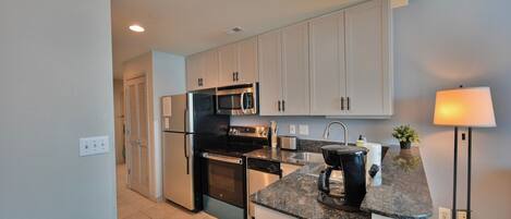 Coffee/tea maker, fridge, microwave, oven