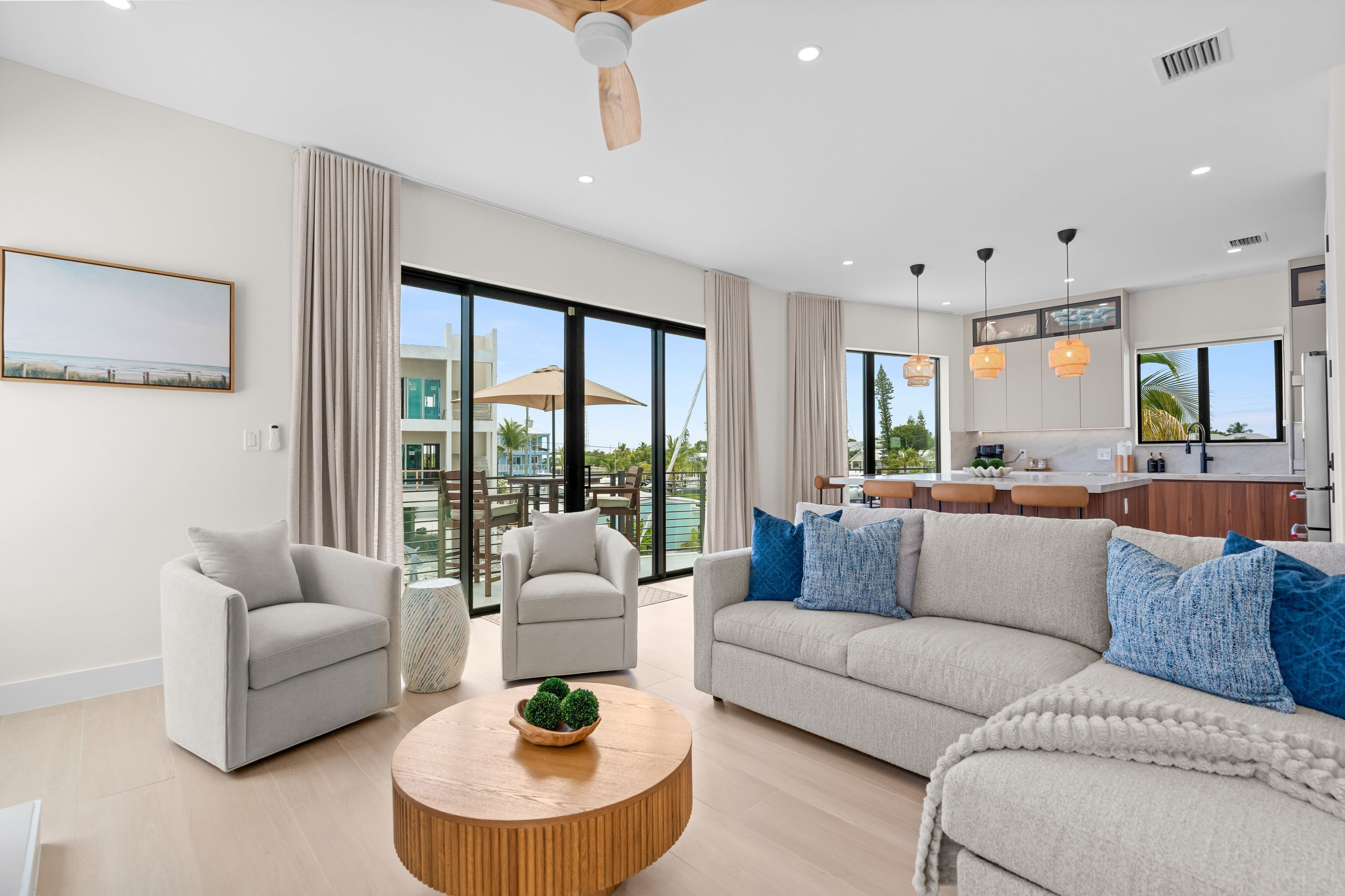 A modern living room with a sofa, armchairs, and a coffee table.
