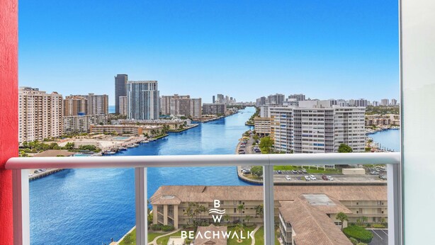 A high-rise building with a view of a river and cityscape. - Cozy Modern Studio Resort Style w/ Sunset Views (Hallandale Beach)