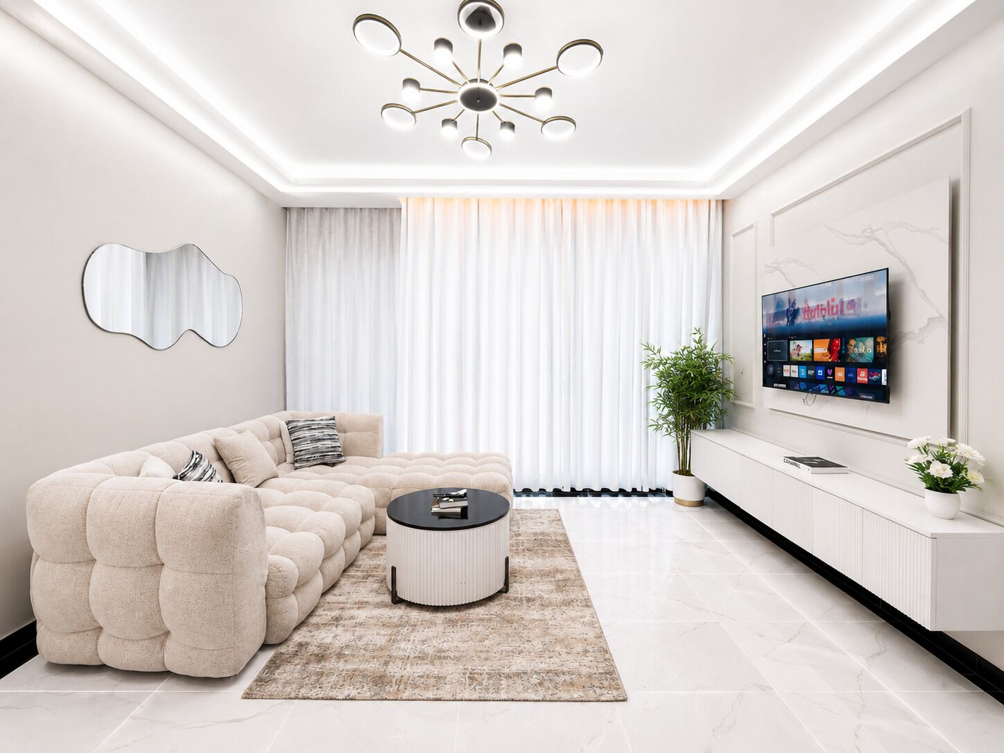 A modern living room with a sectional sofa, a coffee table, a flat-screen TV, and a decorative plant.