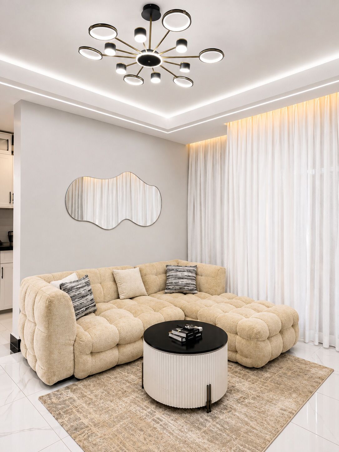 A modern living room with a sectional sofa, a round coffee table, a unique wall art piece, and a ceiling light fixture.