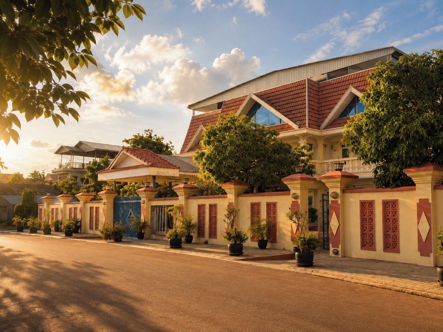 A modern residential building with a symmetrical facade, multiple entry points, and a well-maintained garden.