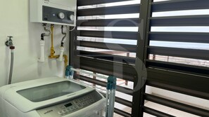 A medical device, possibly a dialysis machine, with a control panel and tubing.