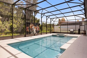 An indoor swimming pool with a glass enclosure, a barbecue area, and a mural of a basketball game. - 15 BD/ 16.5 BA/ Sonoma Resort (4231 SB) (Kissimmee)