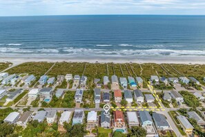 An aerial view of a coastal residential area with houses, a beach, and the ocean. - 2 Min. Walk to Beach/Ocean Views/Hot Tub/Game Room/Bikes/In-Law Suite (St. Augustine)