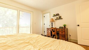 A bedroom with a bed, a dresser, a desk, and a chair. - 3 Bedroom Art Retreat with Billiards and Art Studio near Portland (Vancouver)