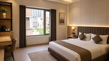 Deluxe Room, City View | In-room safe, desk, laptop workspace, blackout curtains